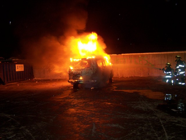 Member advance line to extinguish vehicle fire - Company Drill December 2005