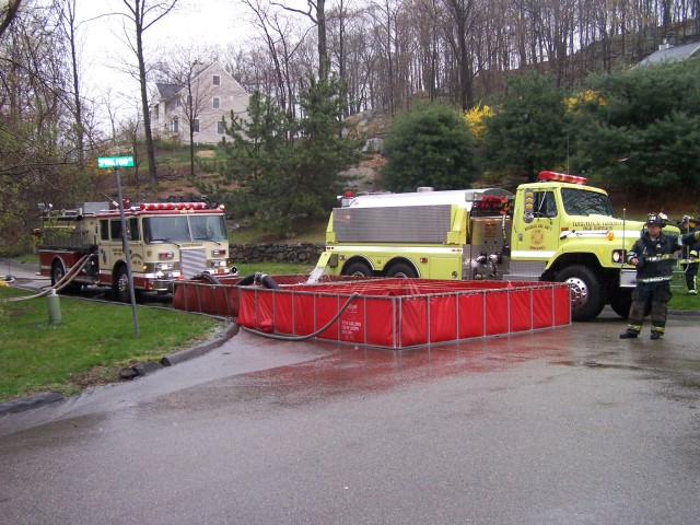 E-106 Pumping out of portable pond at Departmant Tanker Drill - April 2006