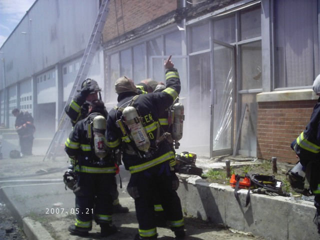 Members of the Independents regroup outside the structure after conducting search of second floor -Department Drill at Grand Union Warehouse