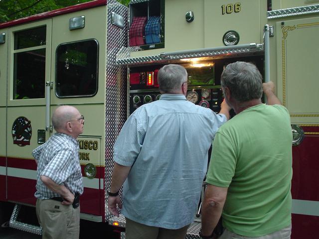 IFCO members Ex-Chief Bill Stewart, George Rubin Jr., and Bob Hartman operate E-106 at drill. (6/25/09)