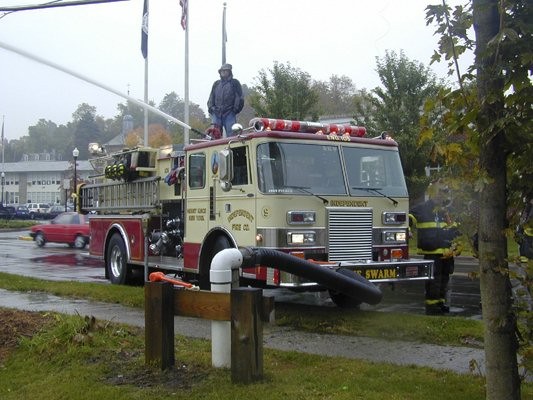 Members parctice drafting out of a pond in downtown Mount Kisco