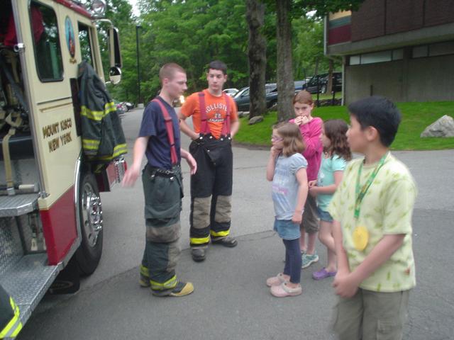 FF James Tipa Jr. and First Responders Club member give a tour of E-105 to FLMS students at FLMS Science Fair. (6/10/09)