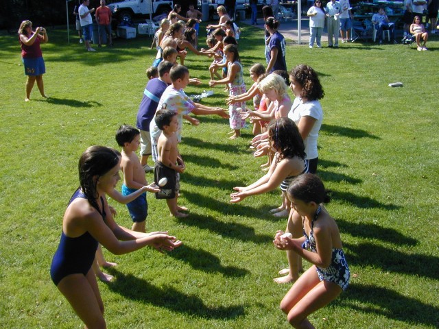 Kids participate in a classic egg toss at our Department picnic