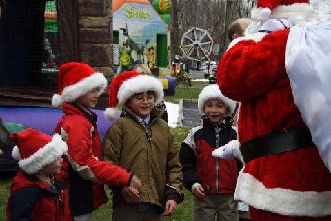 Santa passes out gifts to the kids at Mount Kisco Country Club